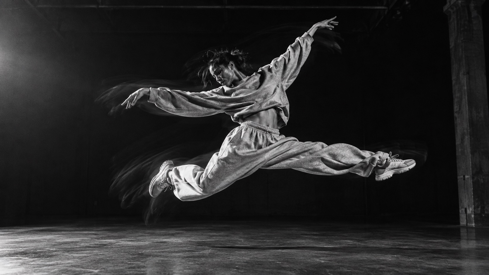 Contemporary dancer suspended in a sideways leap
